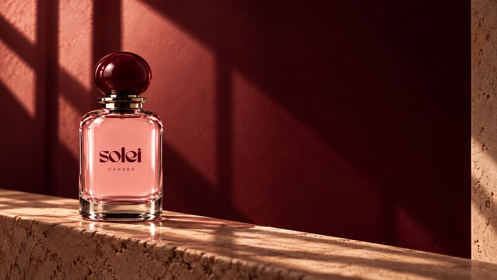 Solei Cannes perfume on a travertine ledge in late-afternoon light
